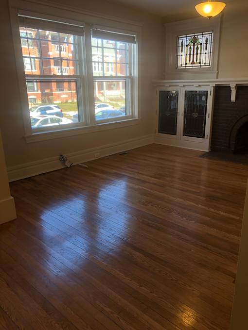 an overhead view of a room with a wood floor and a window