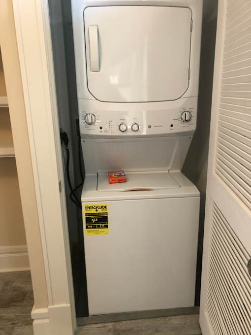 a microwave oven sitting on top of a shelf