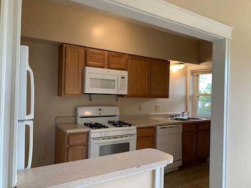 a kitchen with a stove and a microwave