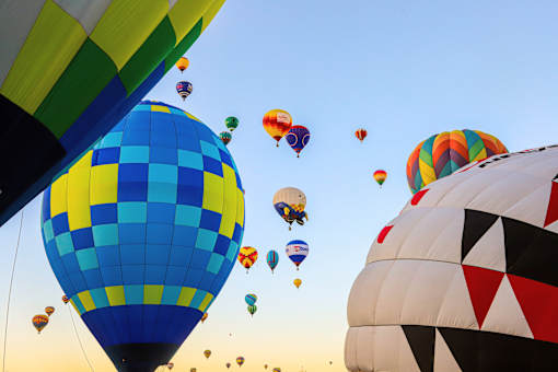 A group of hot air balloons in the sky.