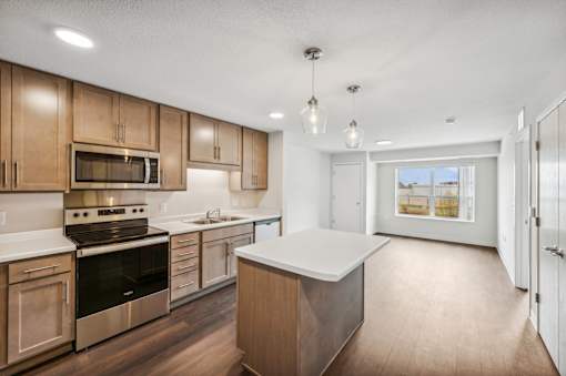 the preserve at ballantyne commons apartment kitchen with wooden cabinets