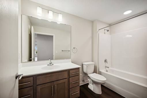 the preserve at ballantyne commons apartment bathroom with sink toilet and shower