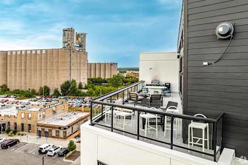 a balcony or terrace with a view of a city