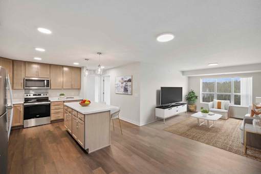 an open kitchen and living room with a table