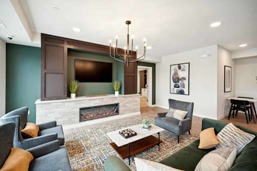 a living room with a fireplace and a tv