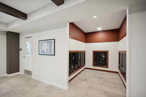 a tasting room with a wall of wine racks and a door to a cellar