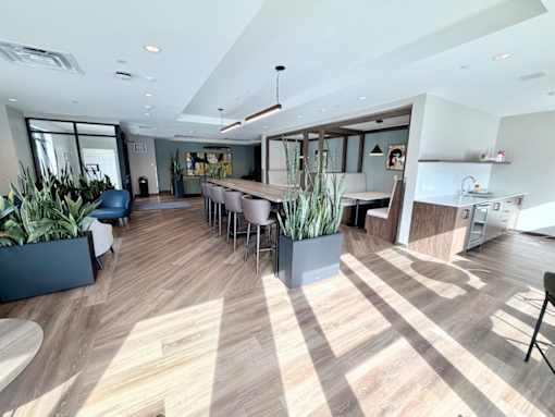 A modern office space with wooden floors and furniture.