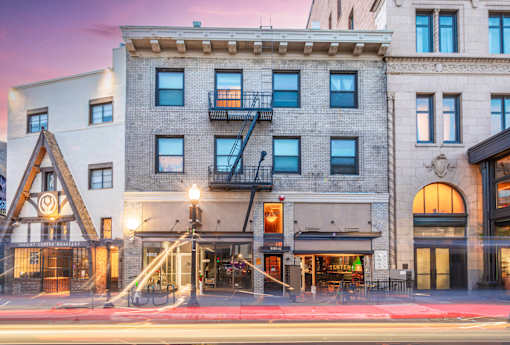 A building with a fire escape on the side.
