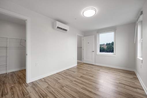 A room with a window and a door.