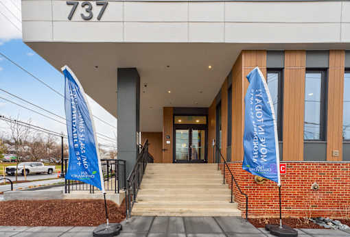 The entrance to a building with a number 737 on the wall.