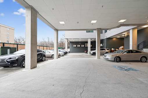 A parking garage with cars parked in it.