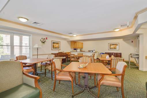 A room with a table and chairs.