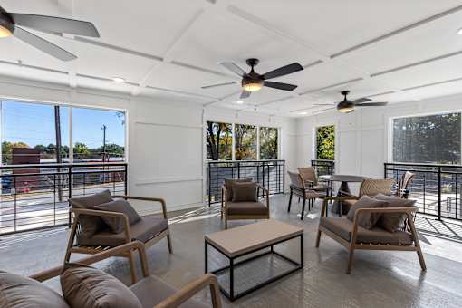 A patio with a table and chairs.