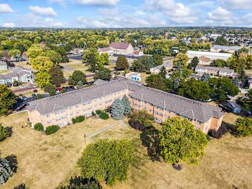 A large building with a grassy area in front of it.