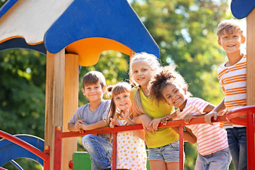 Children playing on a playground slide.