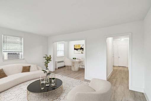 a living room with a white couch and a coffee table
