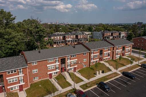 an aerial view of a row of brick apartment buildings