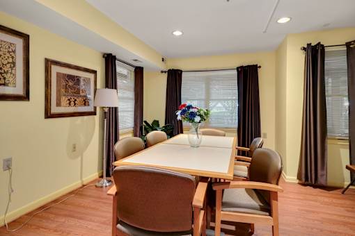 a dining room with a table and chairs