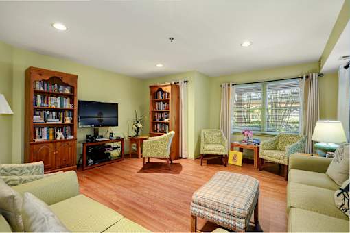 a living room filled with furniture and a tv