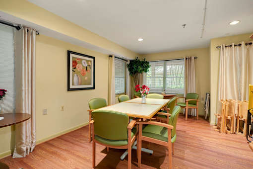 a dining room with a table and chairs