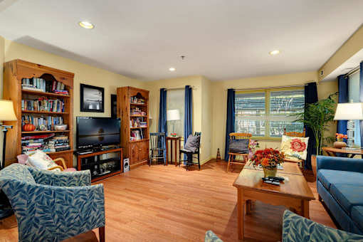 a living room filled with furniture and a tv