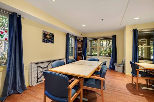 a dining room with a table and chairs
