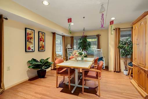 a dining room with a table and chairs