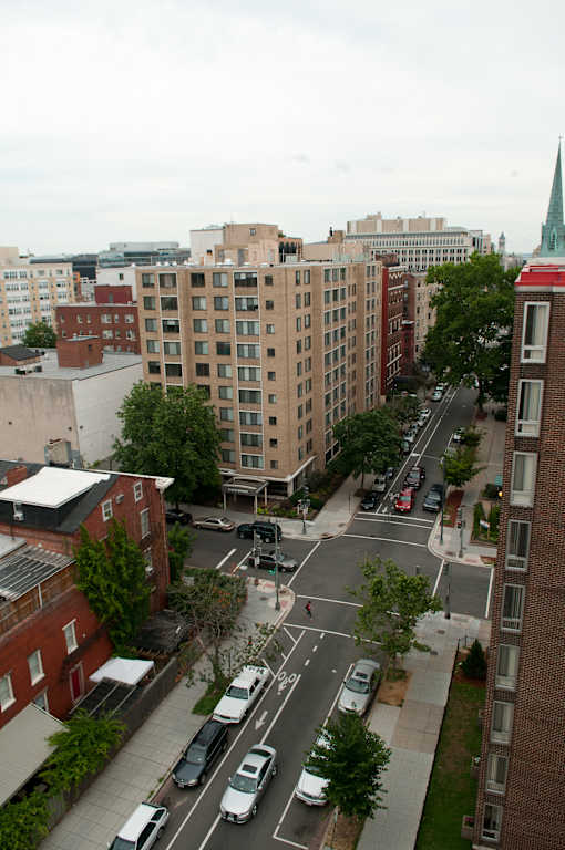 A city street with cars and buildings.