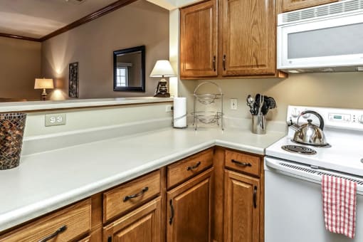 a kitchen with a stove top oven and a sink