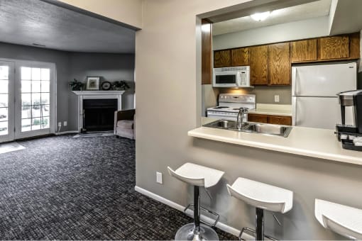 a kitchen with a sink and a refrigerator