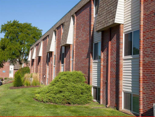 a row of windows on a brick building