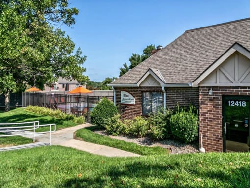 a house with a yard and a fence