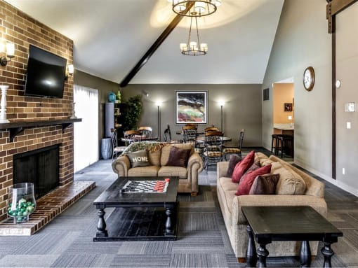 a living room with couches and a fireplace