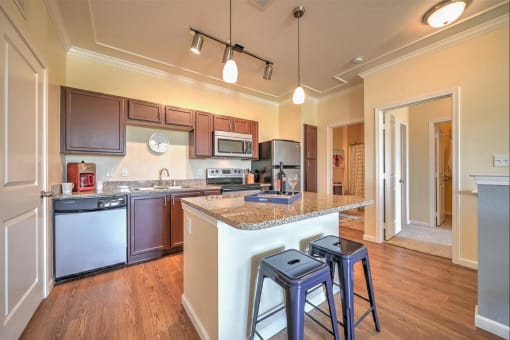 a kitchen with an island and bar stools
