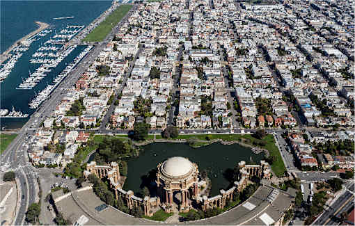 An aerial view of a city with a large open space in the middle.