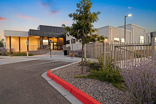 A modern building with a red curb in front of it.