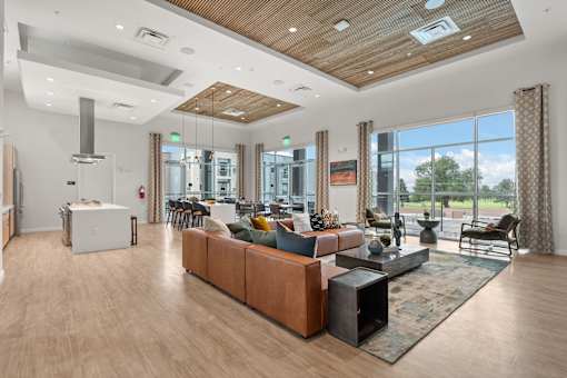 A modern living room with a wooden floor and a large window.