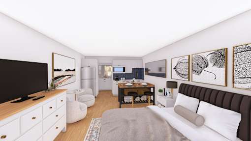 A living room with a white couch, a television, a coffee table, and a painting on the wall.