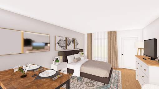 A bedroom with a bed, a dresser, a table with a vase of flowers, and a mirror on the wall.