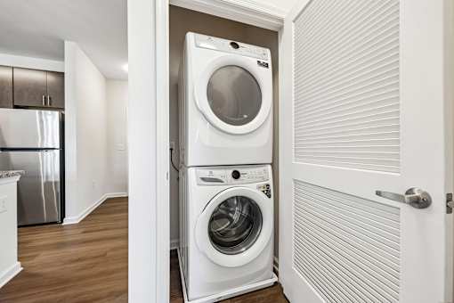 A white washer and dryer in a small laundry room.