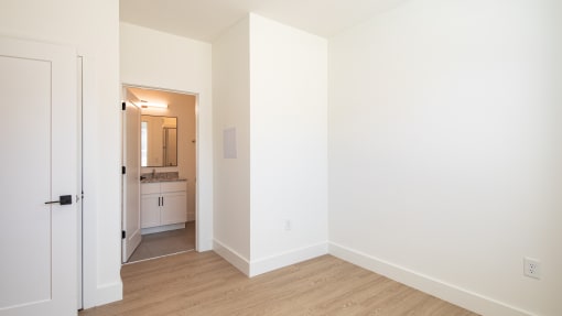 a bedroom with white walls and hardwood floors at Ainsworth, Richmond, Virginia
