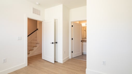 a bedroom with a staircase in a 555 waverly unit at Ainsworth, Virginia