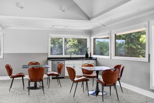a dining room with a table and chairs