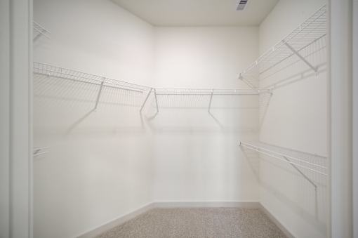 Empty white closet at The Enclave at Deer Moss Creek, Niceville