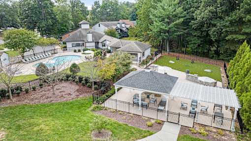 A large house with a pool in the backyard.