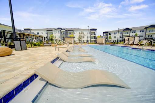Relaxing Pool Area With Sundeck at The Enclave at Deer Moss Creek, Niceville, FL