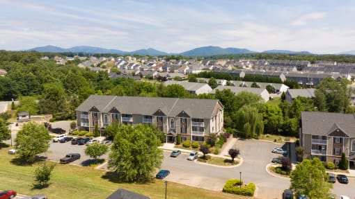 an aerial view of a neighborhood with houses and trees