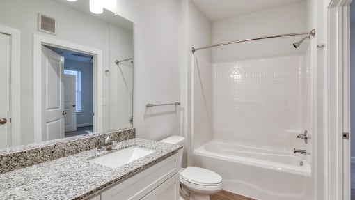 a bathroom with a sink and a shower and a toilet at The Bella at Westchester, Midlothian