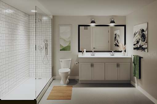 A white tiled bathroom with a toilet, sink, and shower.at Aviator Lofts, Newport News, 23602