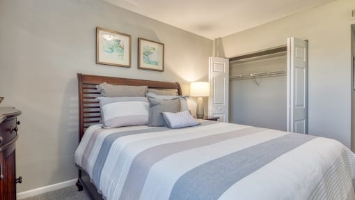 a bedroom with a bed and a closet
